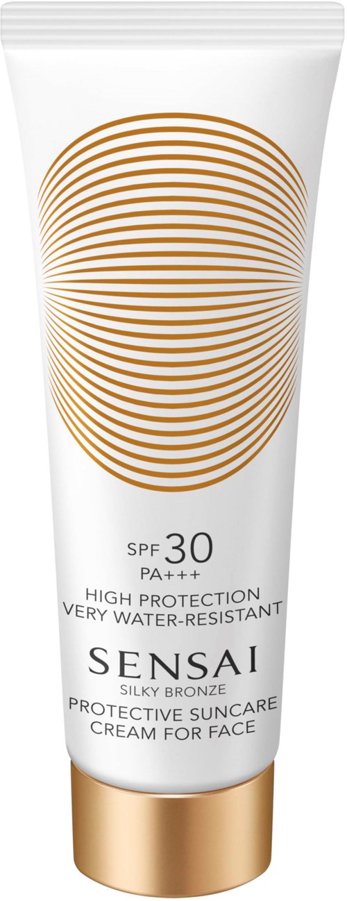 En vit tub med ansiktskräm med guld- och brunt mönster, SPF 30, högt skydd, vattentålig, för ansiktet.