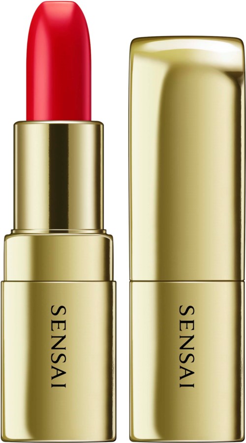 Ein goldener Lippenstift mit roter Farbe und passendem Deckel.