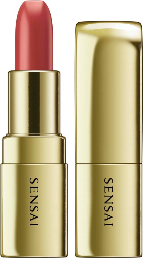 Ein Lippenstift in einer goldenen Verpackung mit dem Markennamen 'SENSIA', geöffnet und teilweise benutzt.