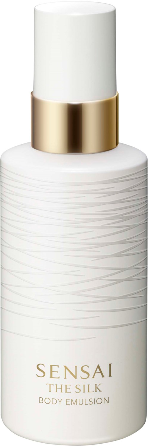 En vit kroppsemulsionsflaska med gulddetaljer och texturerat mönster, märkt 'Sensai the Silk Body Emulsion.'