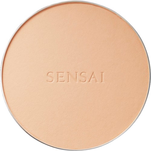 Een ronde beige compact met de merknaam 'SENSAI' ingedrukt in het midden.