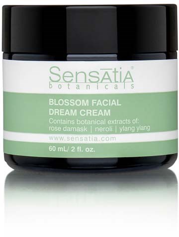 A jar of Sensatia Blossom Facial Dream Cream with green and white label and black lid.