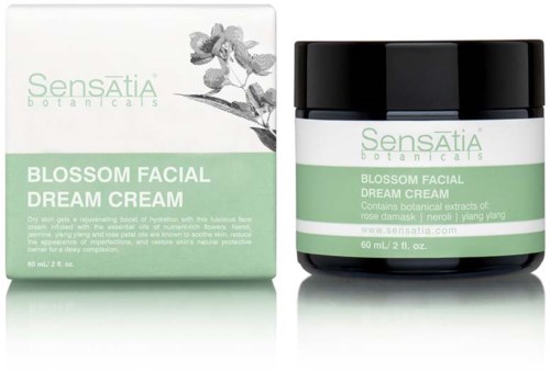 A jar and box of Sensatia Botanicals Blossom Facial Dream Cream, green and white, small flower image on packaging.