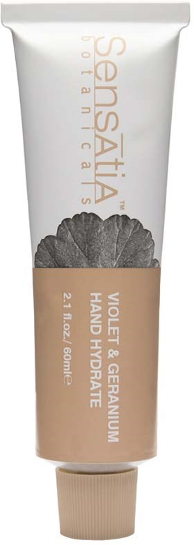 A white tube of hand cream with a beige label, black ginkgo leaf image, and text about ingredients and brand.