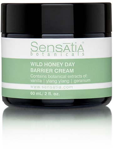 A jar of Sensatia botanicals barrier cream with black lid, green and white label, containing honey, vanilla, ylang ylang, and geranium.
