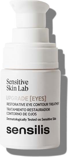 A white bottle of eye cream labeled 'Sensitive Skin Lab' and 'Sensilis', designed for eye contour treatment.