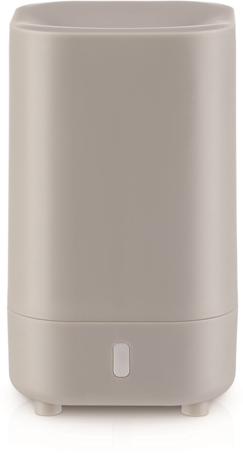 En lång, beige, cylindrisk luftfuktare med en liten kontrollknapp nära basen.