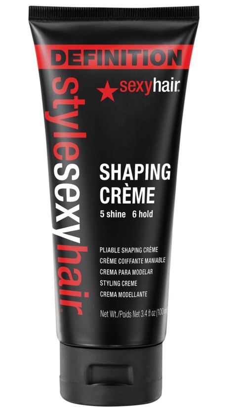 En svart och röd tub med texten 'Definition sexy hair shaping crème' för att styla håret.