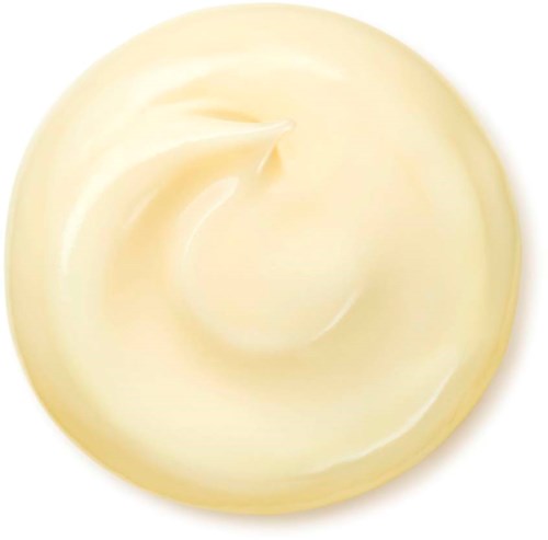 Creamy, smooth, pale yellow substance in a circular shape with a swirl pattern.