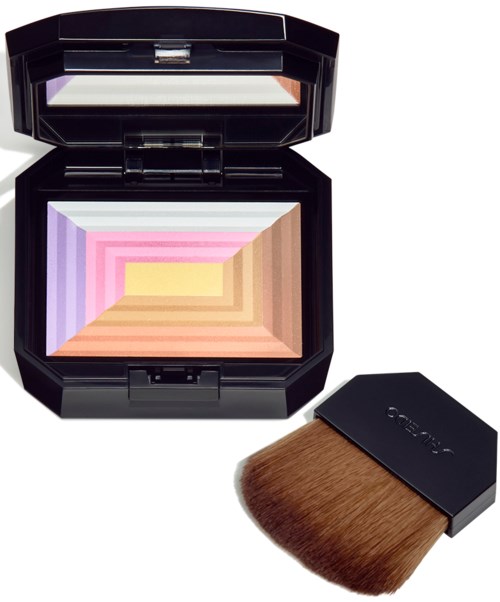 A compact case holds colorful, geometric powder and a brush for makeup application.
