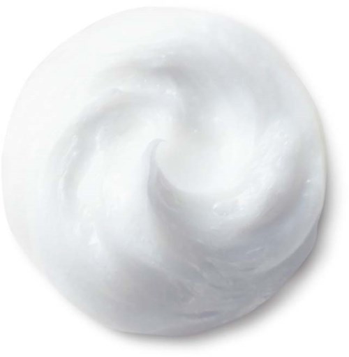 A white, creamy, swirled substance in a small round dish.
