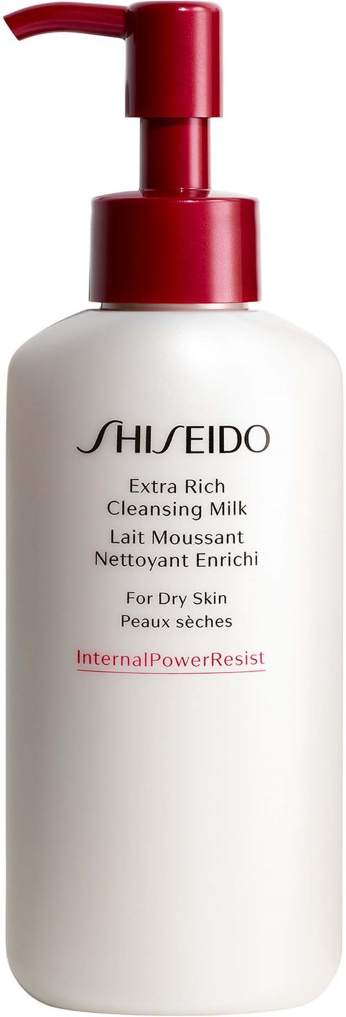 Valkoinen pullo, jossa on punainen pumppu, sisältää Shiseido Extra Rich Cleansing Milk kuivalle iholle.