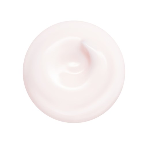En hvit krem eller lotion på en hvit overflate, med en liten topp i midten.