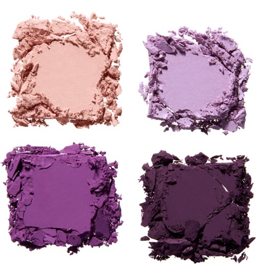 Vier zerdrückte Lidschattenschatten in Rosa, Helllila, Lila und Dunkellila Farben.