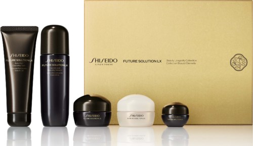 Skincare products in black and white containers with a gold box behind, labeled 'Future Solution LX'.