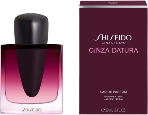 A perfume bottle with a black cap next to purple packaging box for Shiseido Ginza Datura perfume.