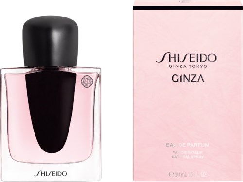 En parfume flaske og æske, pink og sort farve, med SHISEIDO og GINZA skrevet på.