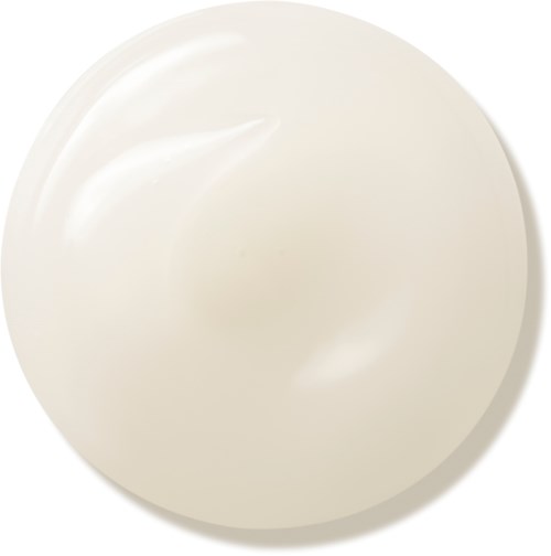 En vit, rund klick av grädde eller yoghurt på en enkel bakgrund.