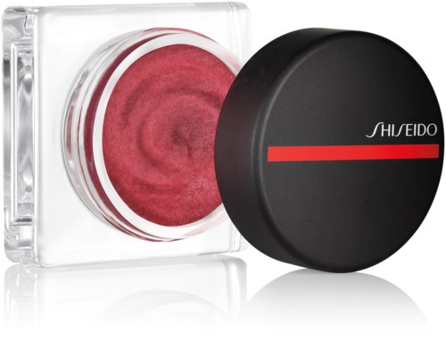 Et glass med rosa krem og svart lokk, merket Shiseido, vist på en hvit bakgrunn.