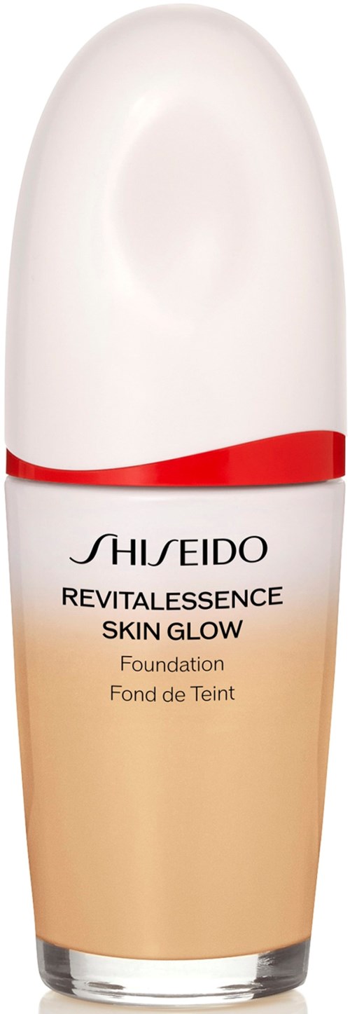 A bottle of Shiseido skin glow foundation with a white cap and a beige base. Text on the bottle in black.