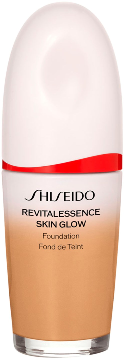 A bottle of Shiseido Revitalessence Skin Glow foundation with a white cap and a red line.