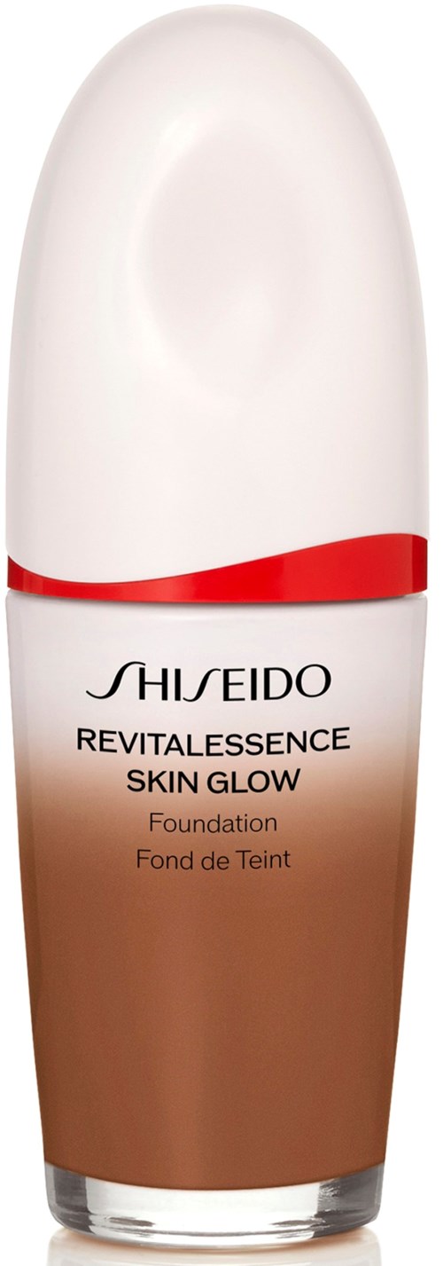 En flaske av Shiseido Revitalessence Skin Glow foundation med hvit lokk og brun kropp.