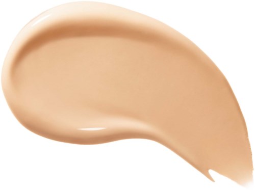 Ett provbad av beige flytande foundation med ett slätt, något bucklat spread.