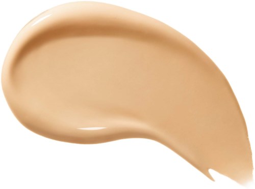 En klump av beige flytande makeup eller hudkräm med slät, glänsande yta.