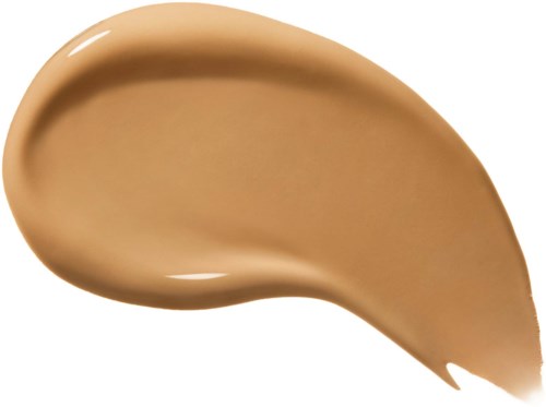 Ett stryk av beige eller ljusbrun vätska eller kräm, slät och glänsande, formad som en tår eller skedfull.