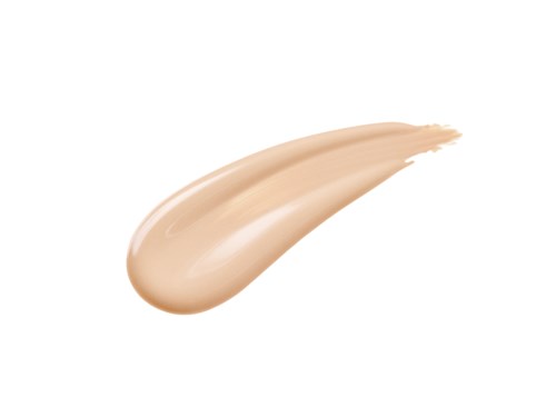 Ein beige Make-up-Grundierungstrang vor weißem Hintergrund.
