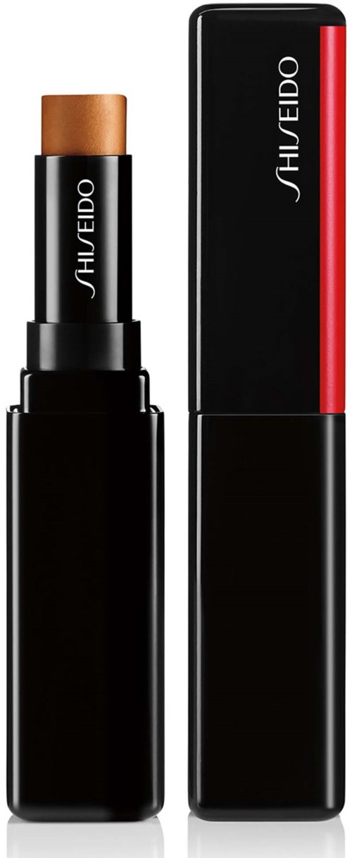 En läppstiftsrör och dess lock, båda svarta med märket Shiseido skrivet på dem. Läppstiftet är i en ljusbrun nyans.