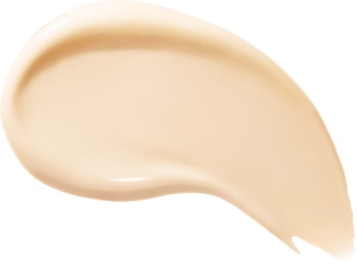 En beige kräm eller lotion utsmetad i en kurva på en vit bakgrund.