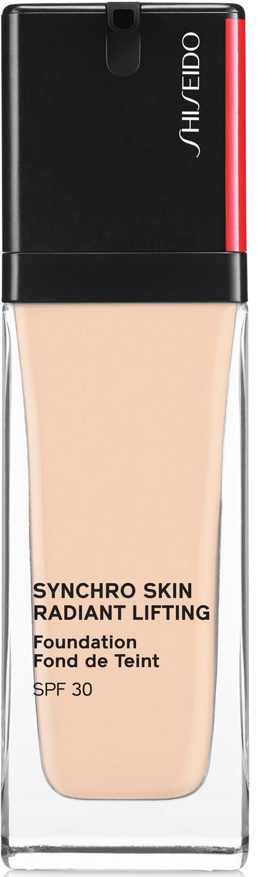 En flaske foundation med svart lokk, beige væske og tekst som indikerer at den er Shiseido Synchro Skin Radiant Lifting.