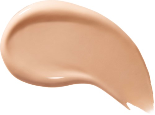 En svep av beige foundation eller kräm med slät, kurvig form och glansig yta.