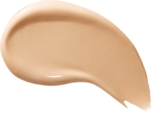 En ljusbeige vätska eller kräm som är formad som en tår droppe, slät och glansig.