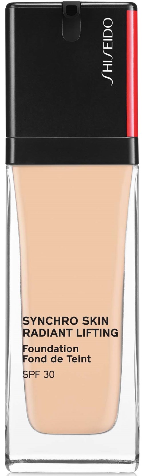 En foundationflaska med SPF 30 från Shiseido, märkt Synchro Skin, Radiant Lifting och Foundation. Den har ett svart och rött lock.