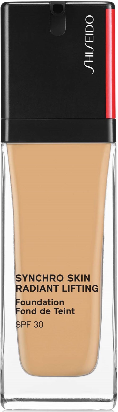 Foundationflaske i leppestiftstil med svart, rødt og klart emballasje, merket "Synchro Skin Radiant Lifting," SPF 30.