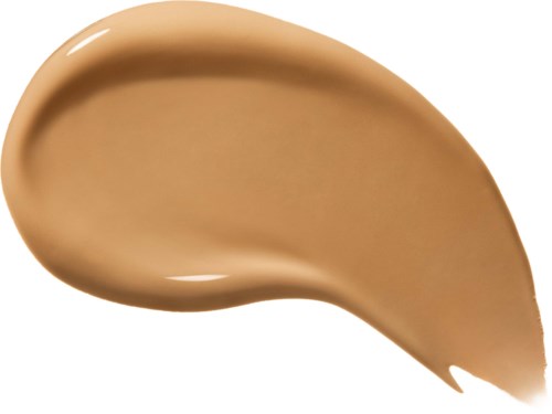 En stripe av beige væske, glatt og kremete, på en hvit bakgrunn.