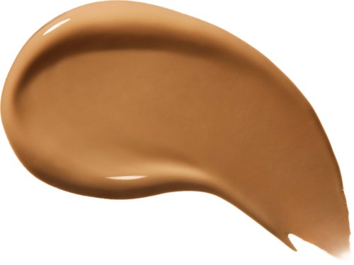 Ett drag av ljusbrun krämig vätska, sannolikt grundläg och kosmetisk produkt.