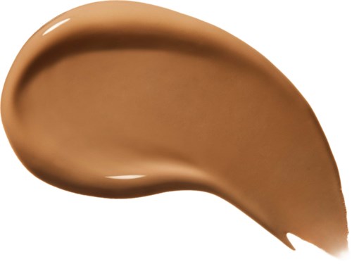 A smear of beige-colored creamy makeup or lotion with a smooth, curved shape.