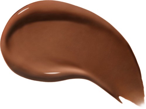 En glatt, brun substans, sannsynligvis sjokolade, formet med en liten kurve og skinnende overflate.