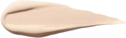 A smear of beige-colored cream or lotion with a pointed end on a white background.