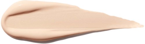 A dollop of beige-colored cream or lotion is spread on a white background.