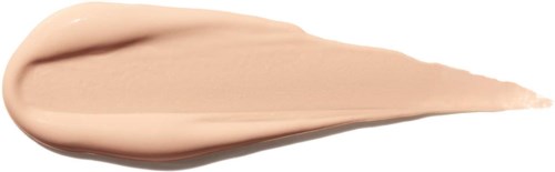 En beige krem eller lotion med spiss tupp, spredd ut på hvit bakgrunn.