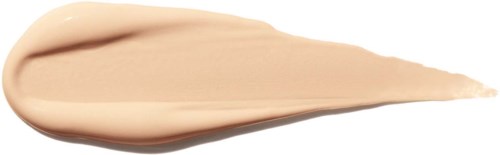 En beige krem eller lotion med tårformet form på hvit bakgrunn.