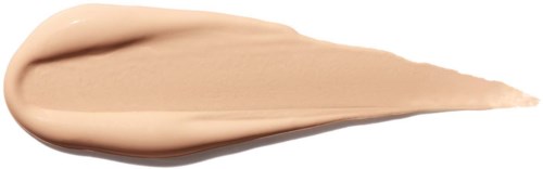 En beige krem spredt i en tårulignende form på hvit bakgrunn.