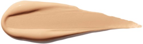 En beige kremaktig substans er spredd i dråpeform, med en tykk rounded end og en spiss spiss.