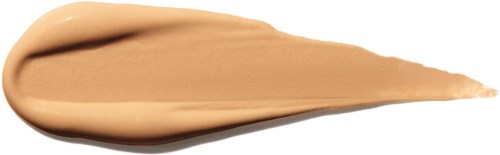 En klatt av beige sminke eller krem med spiss ende på svart bakgrunn.