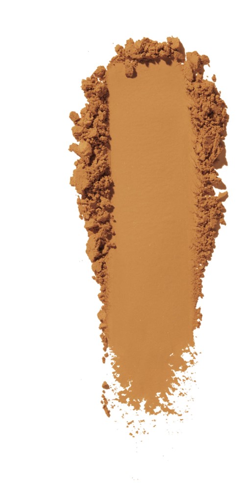 Ruskeaa jauhetta, jota ympäröi jauhe, valkoisella taustalla.