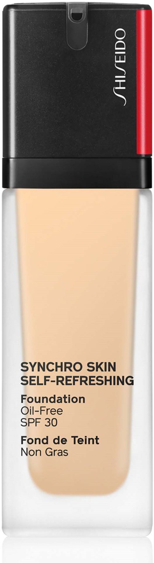 Eine Flasche Shiseido Foundation mit schwarzem und rotem Deckel und beige Flüssigkeit.